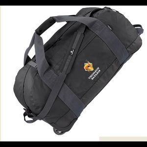 Eagle Creek black duffel. Thomson Safari logo.